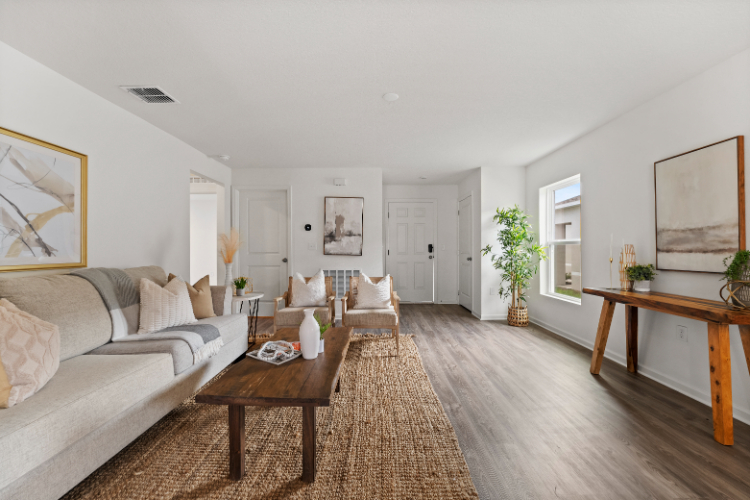 A living room with a wood floor.