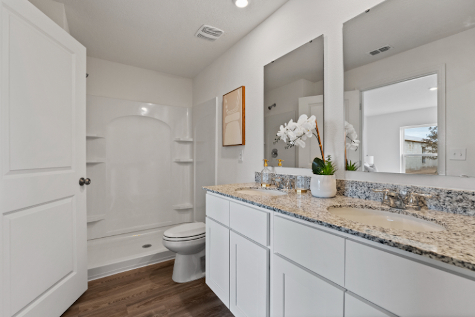A bathroom with a marble countertop.