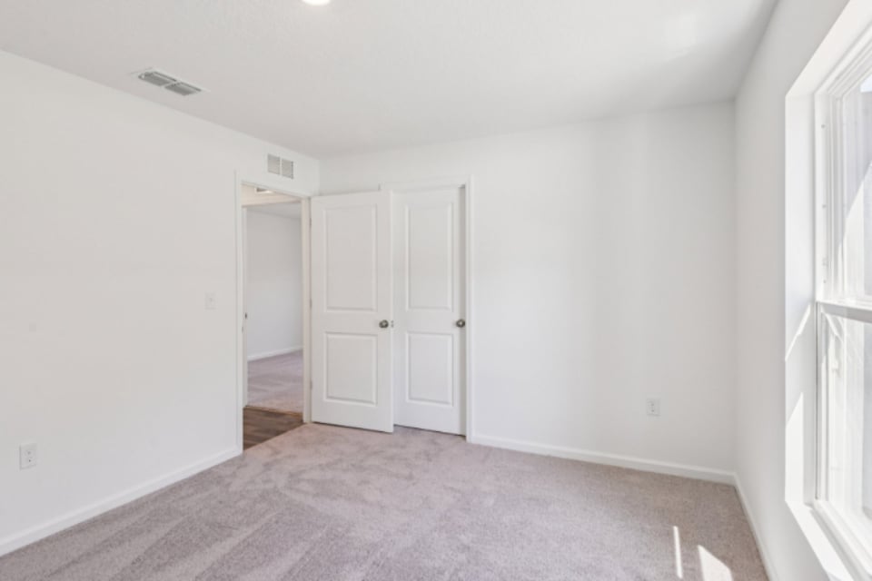 A room with white doors.