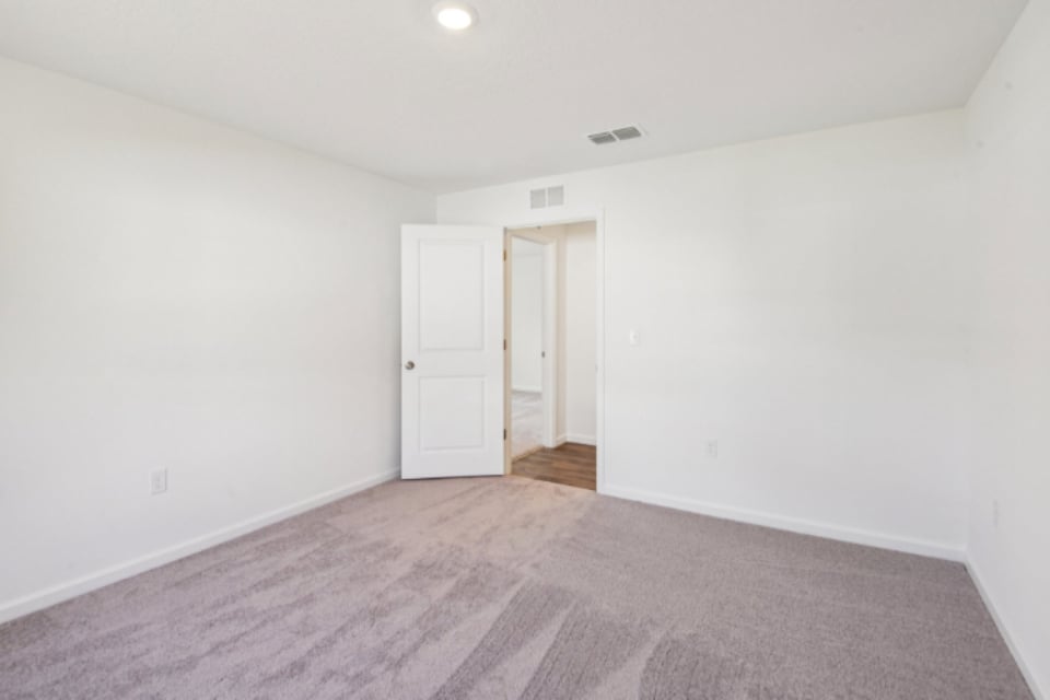 A hallway with white doors.