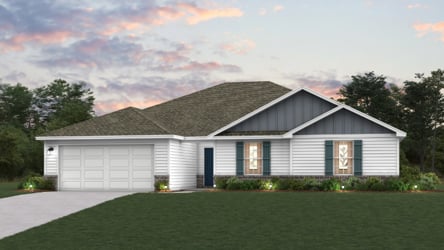 A house with a lawn in front of it.