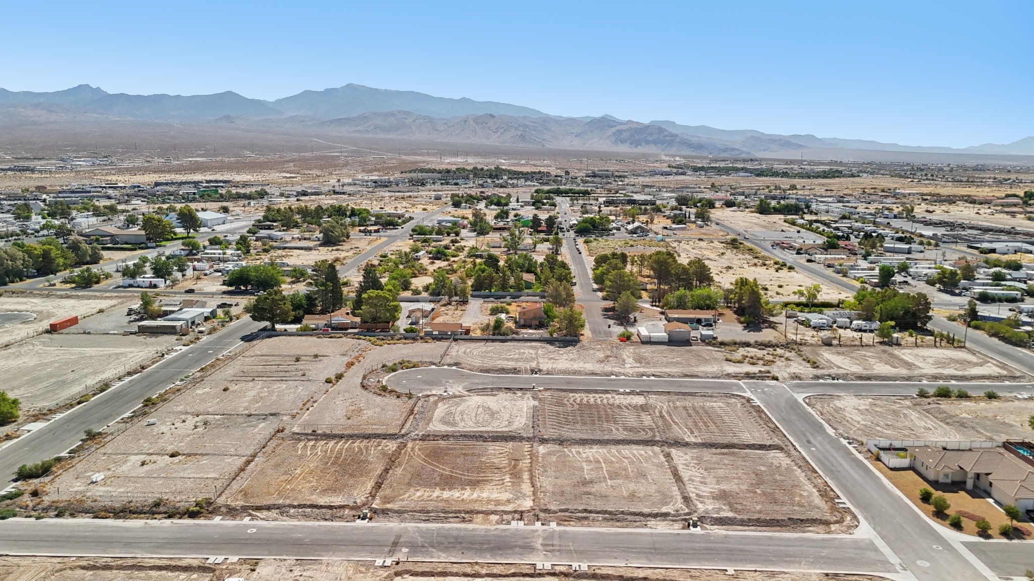 A landscape with a road and buildings.