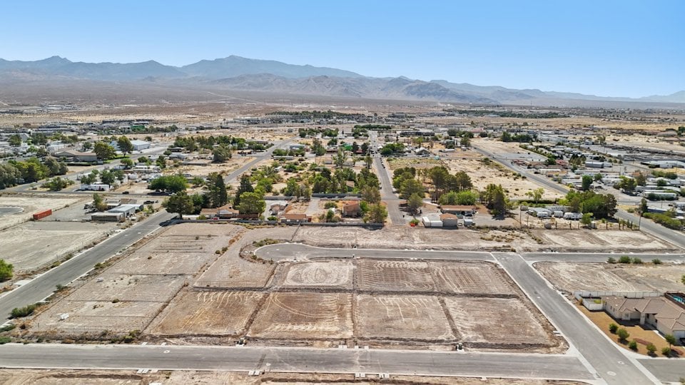A landscape with a road and buildings.