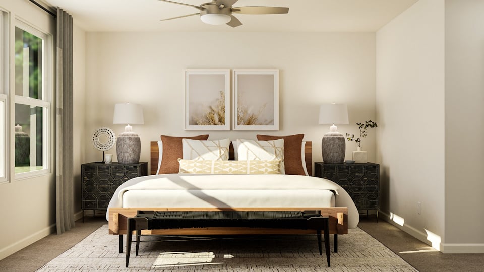 A bedroom with a bed and a fireplace.