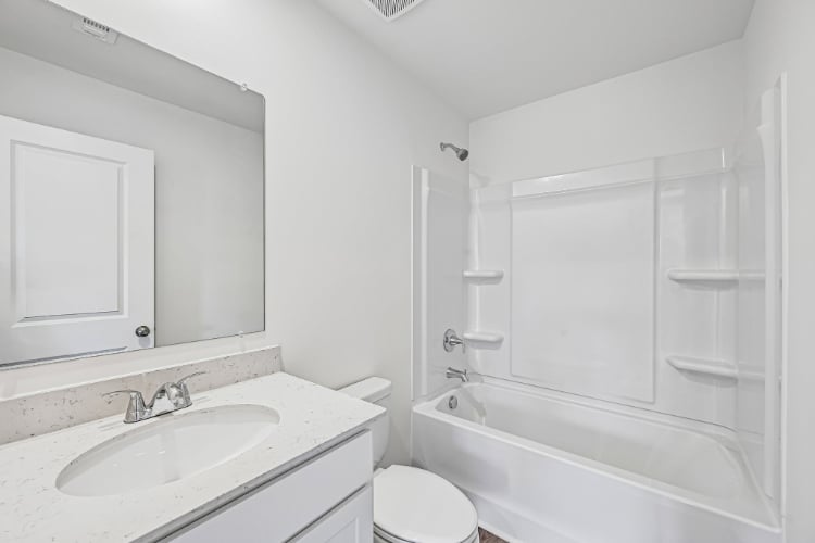 A bathroom with a sink and a toilet.