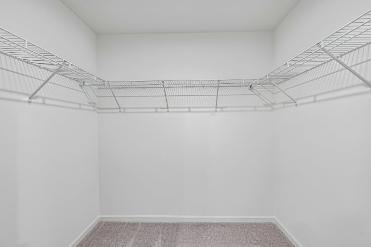 A white room with a staircase.