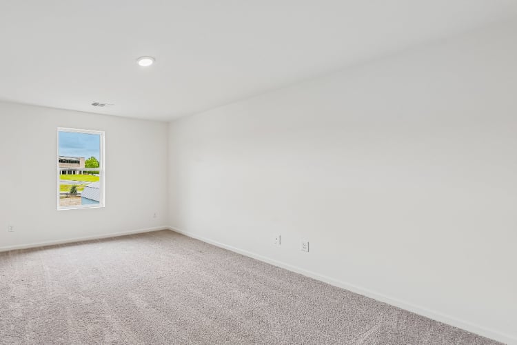 A white wall with a poster on it.