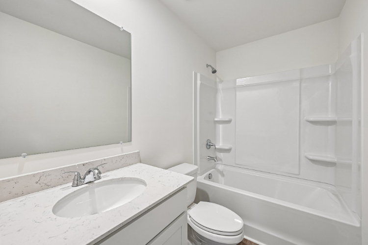 A bathroom with a sink and a toilet.
