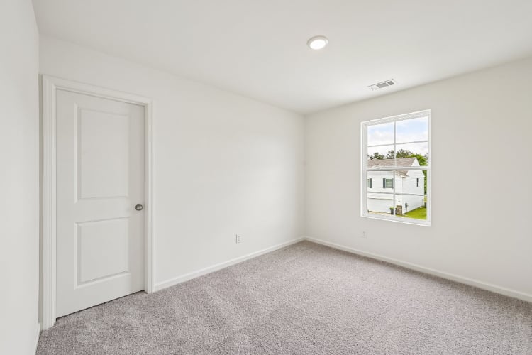 A room with a door and a window.
