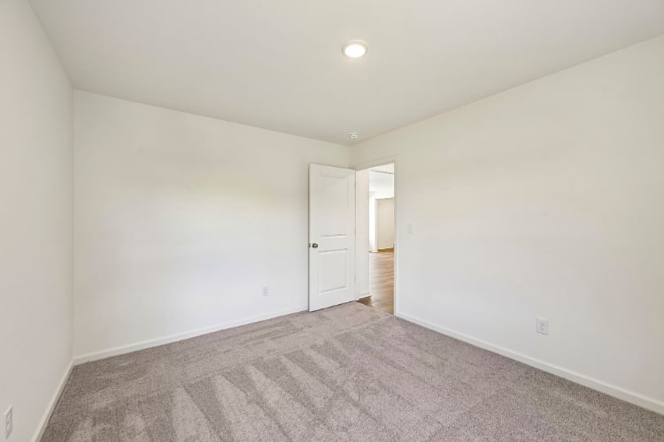 A hallway with white doors.