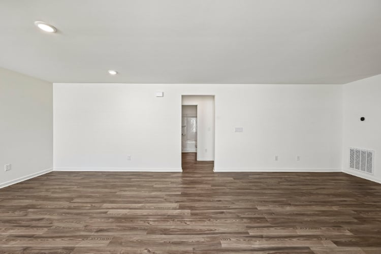 A room with a wood floor and a wood floor.
