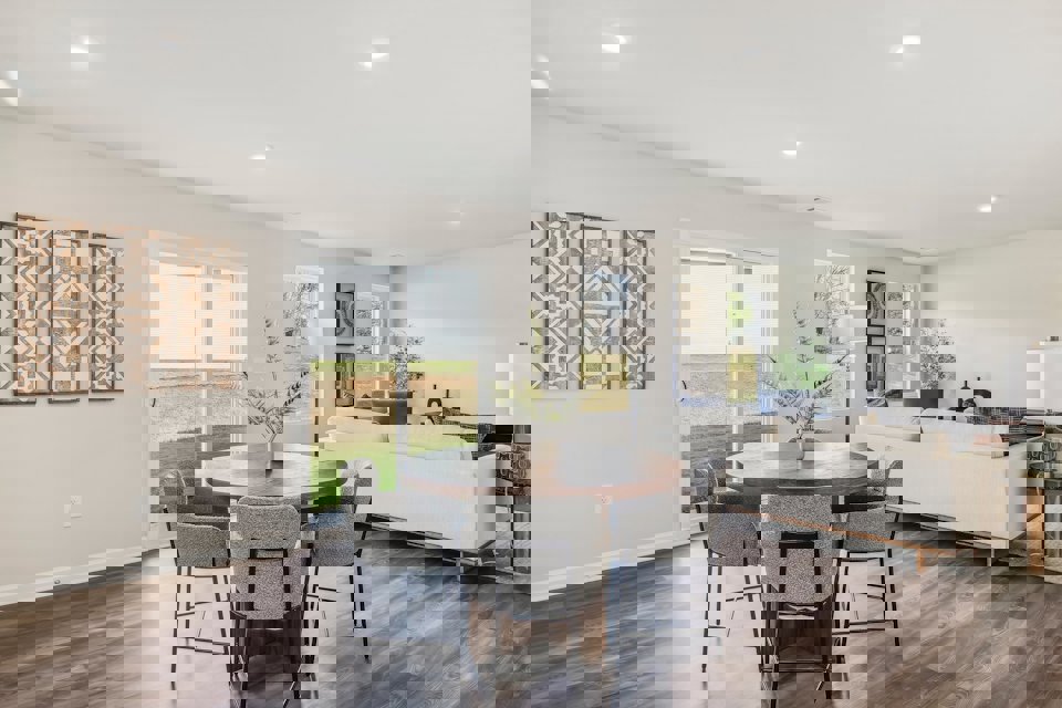 A living room with a couch and a table.