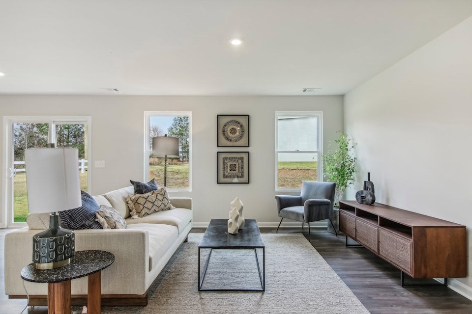A living room with a couch and a table.