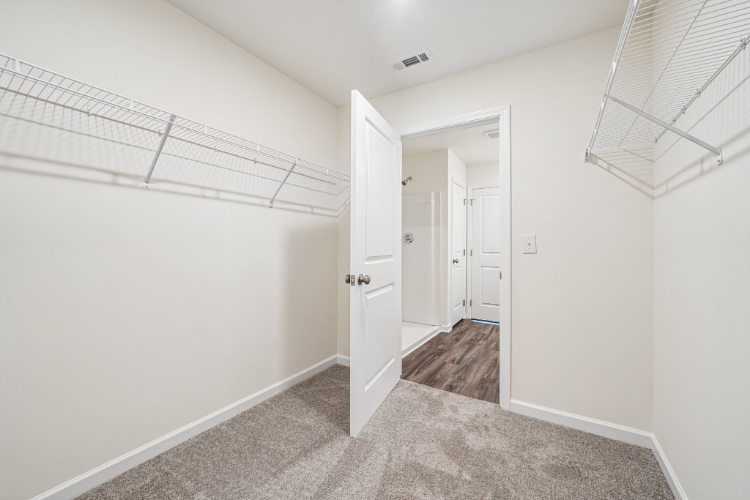 A hallway with white doors.