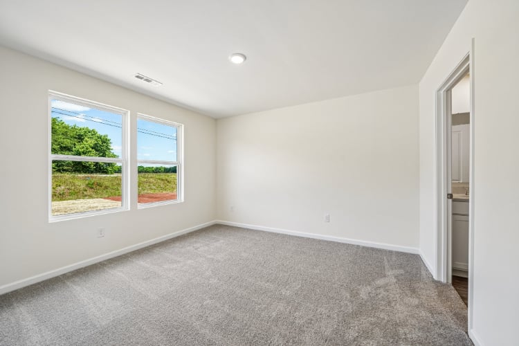 A room with a window and a door.