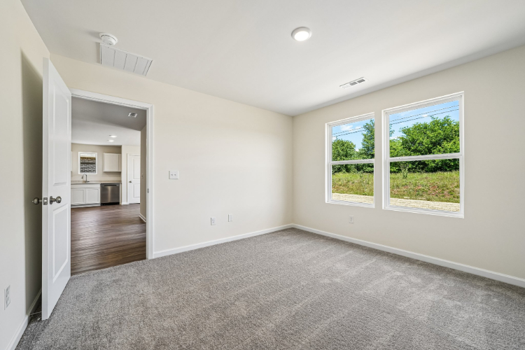 A room with a window and a door.