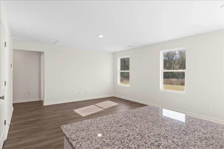 A room with a rug and a rug.