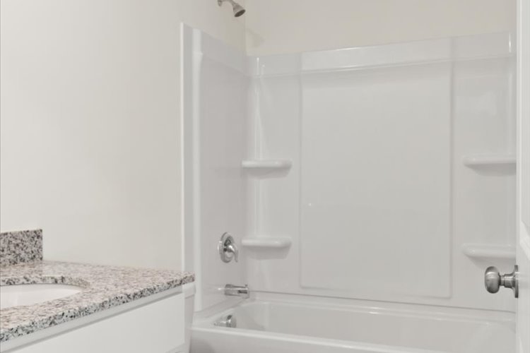 A bathroom with a glass shower.