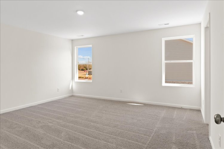 A room with a tile floor and a window.