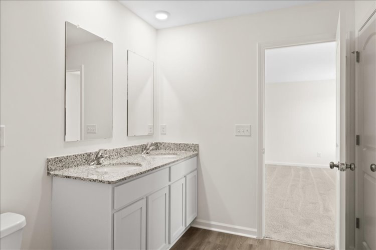 A bathroom with a sink and a shower.
