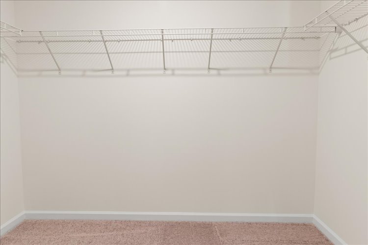 A white wall with a vent.