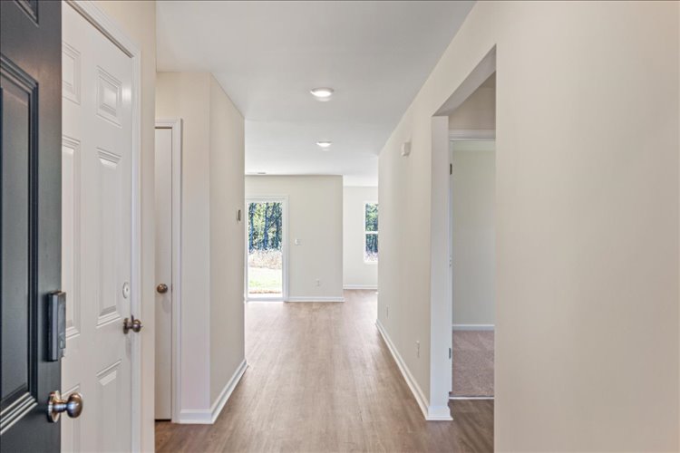 A hallway with white doors.