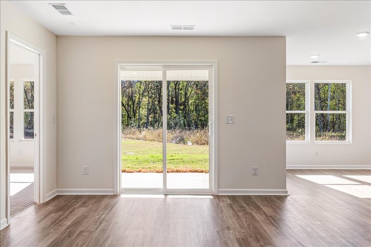 A room with a large glass door.