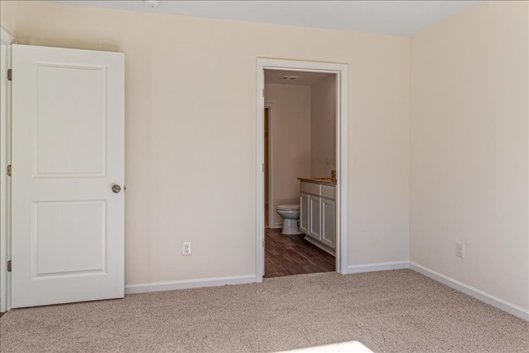A bathroom with a toilet and a sink.