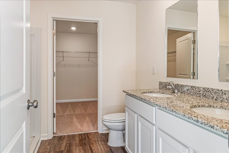 A bathroom with a marble countertop.