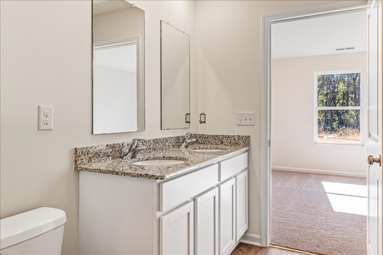 A bathroom with a marble countertop.