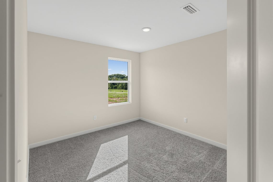 A hallway with a window.