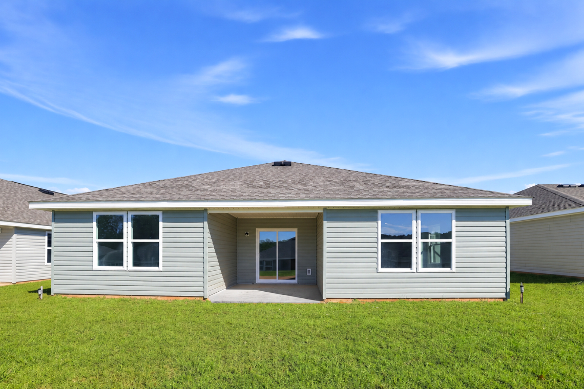 A house with a grass yard.