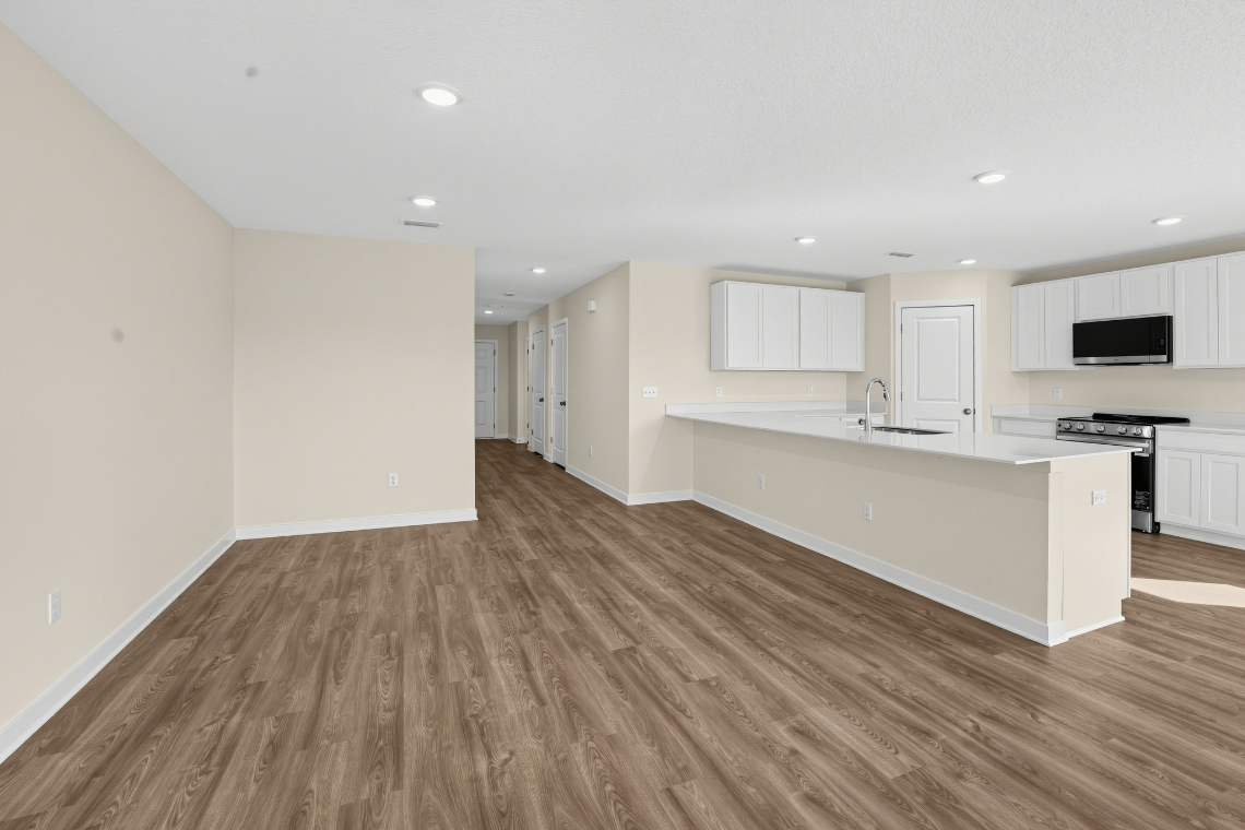 A large kitchen with white cabinets.
