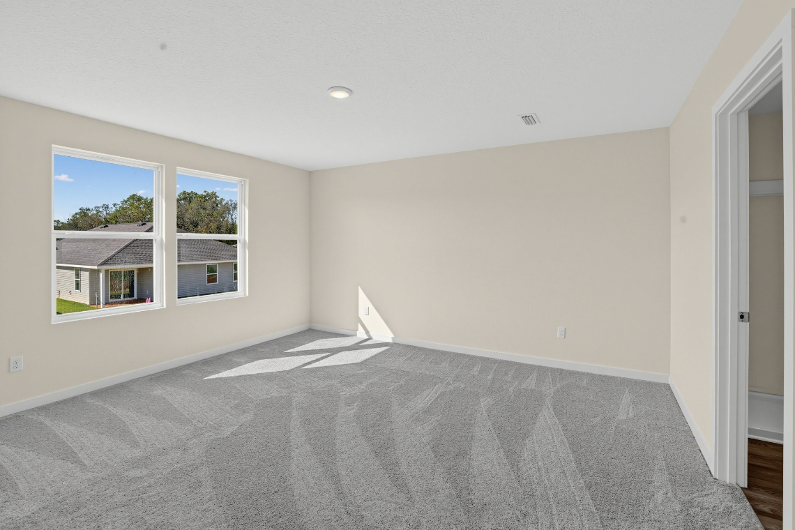A room with a bed and a window.