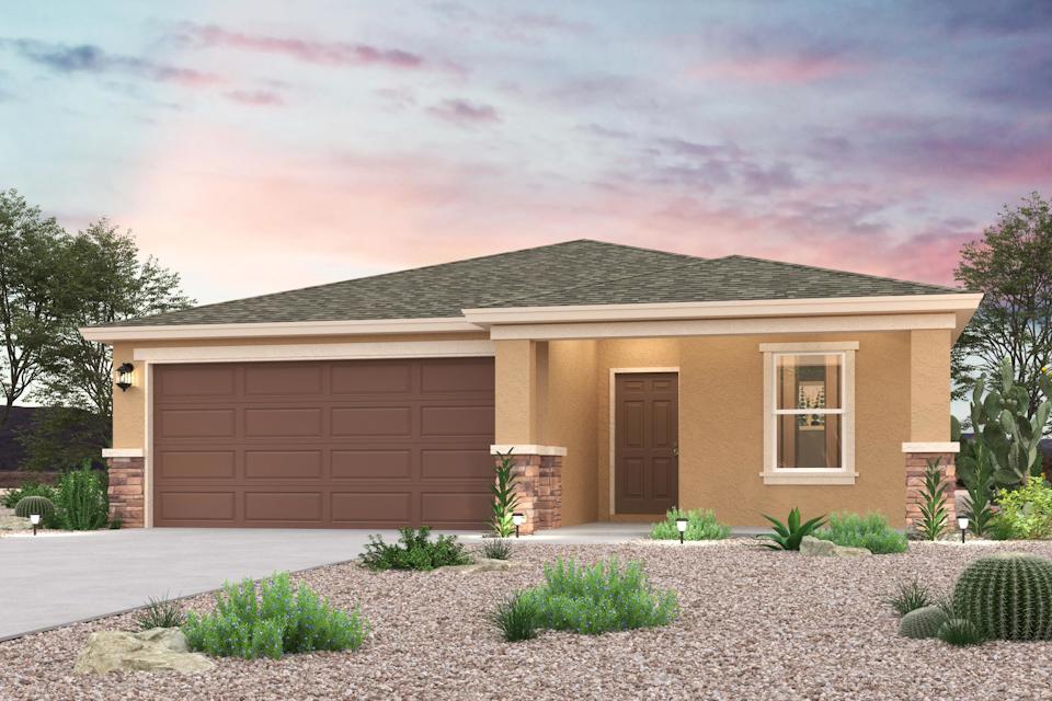 A house with a gravel driveway.