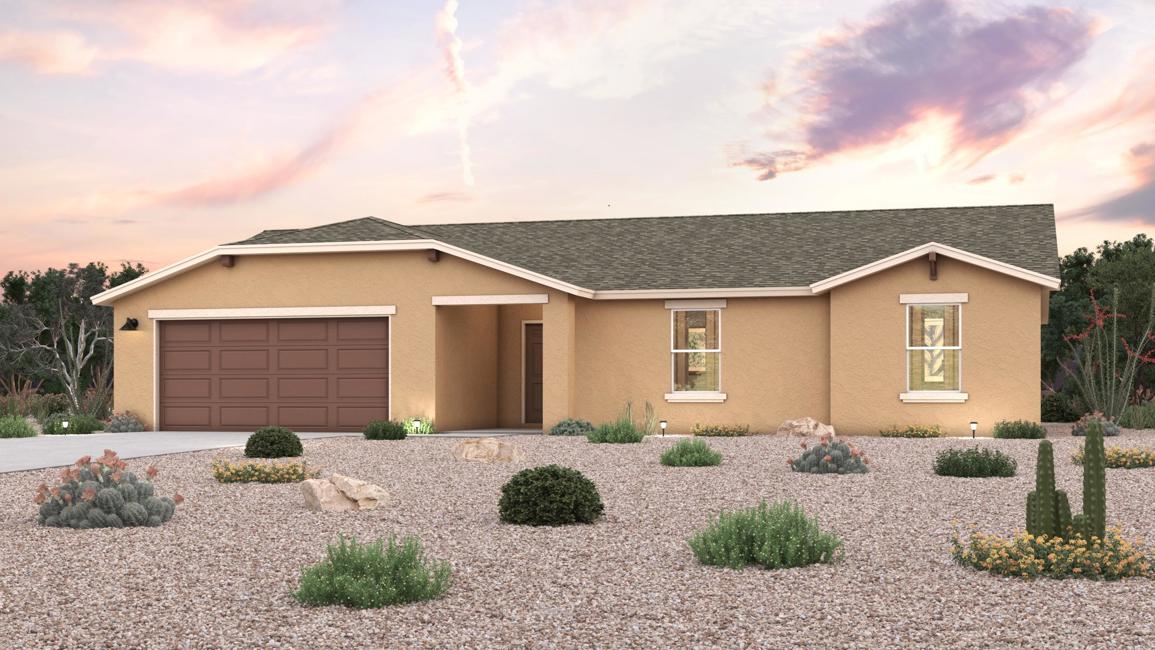 A house with a gravel driveway.