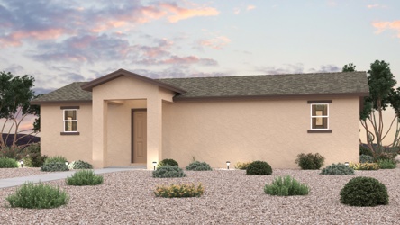 A house with a gravel driveway.