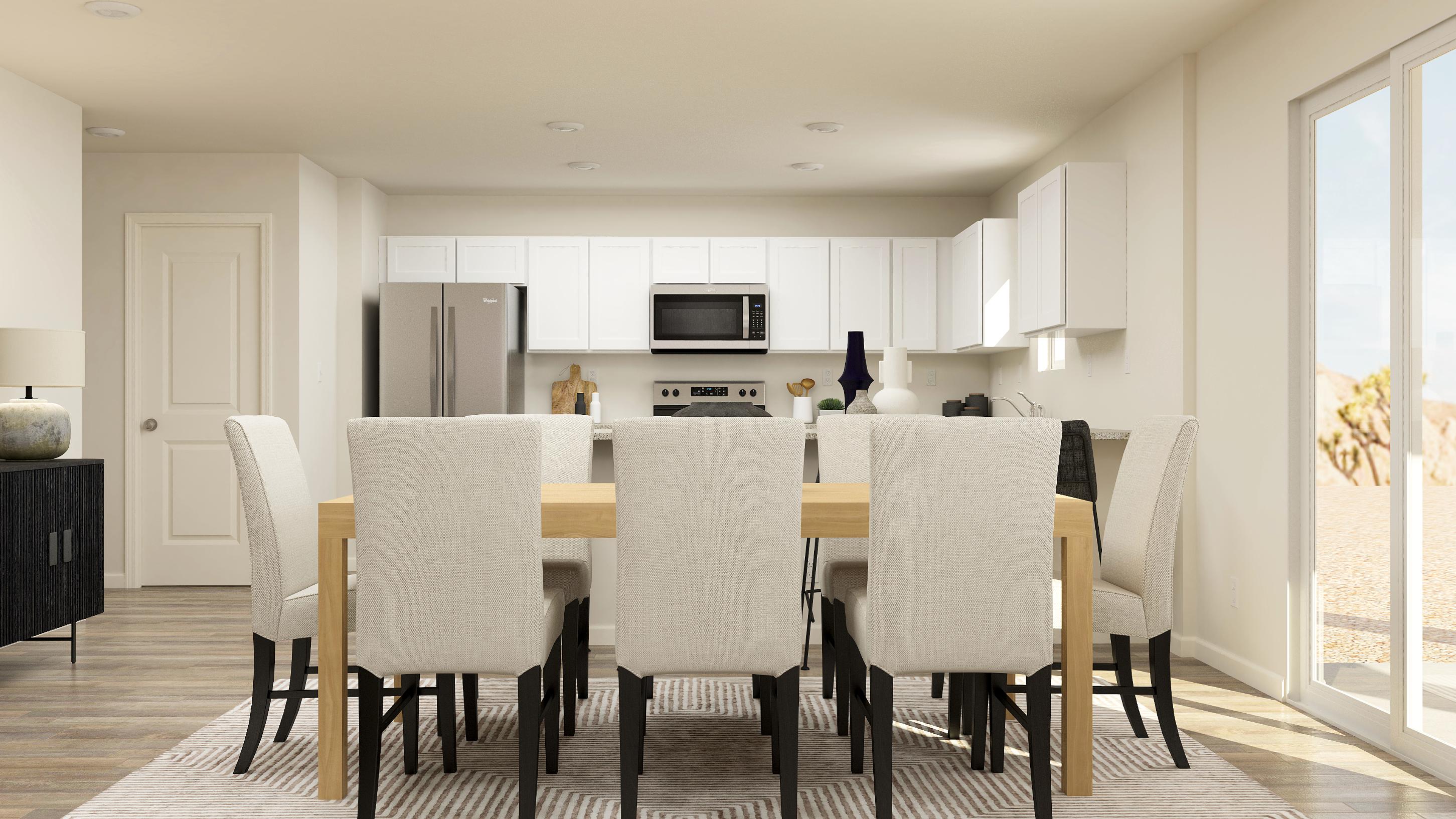 A kitchen with a dining table.