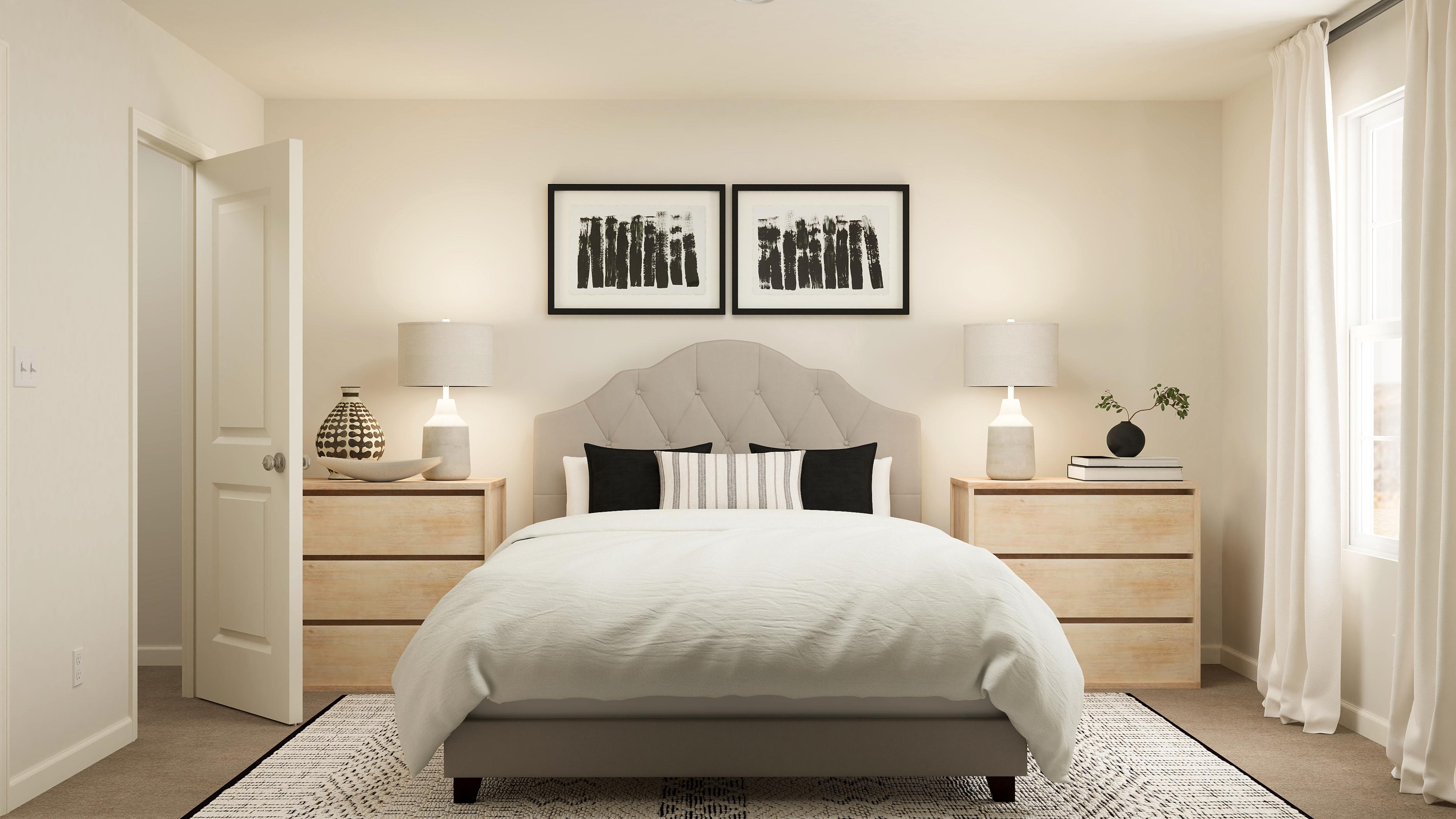 A bedroom with a bed and lamps.