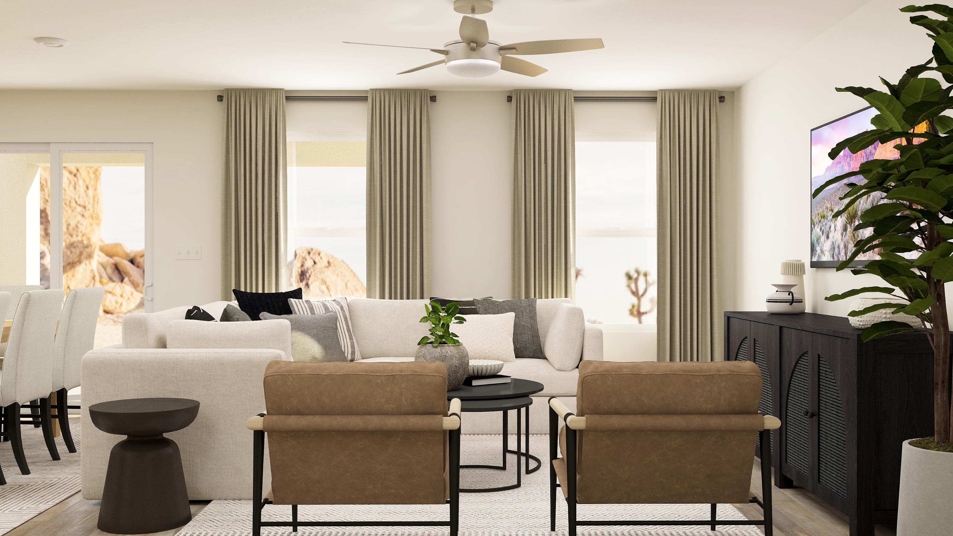 A living room with a white couch and a white table.