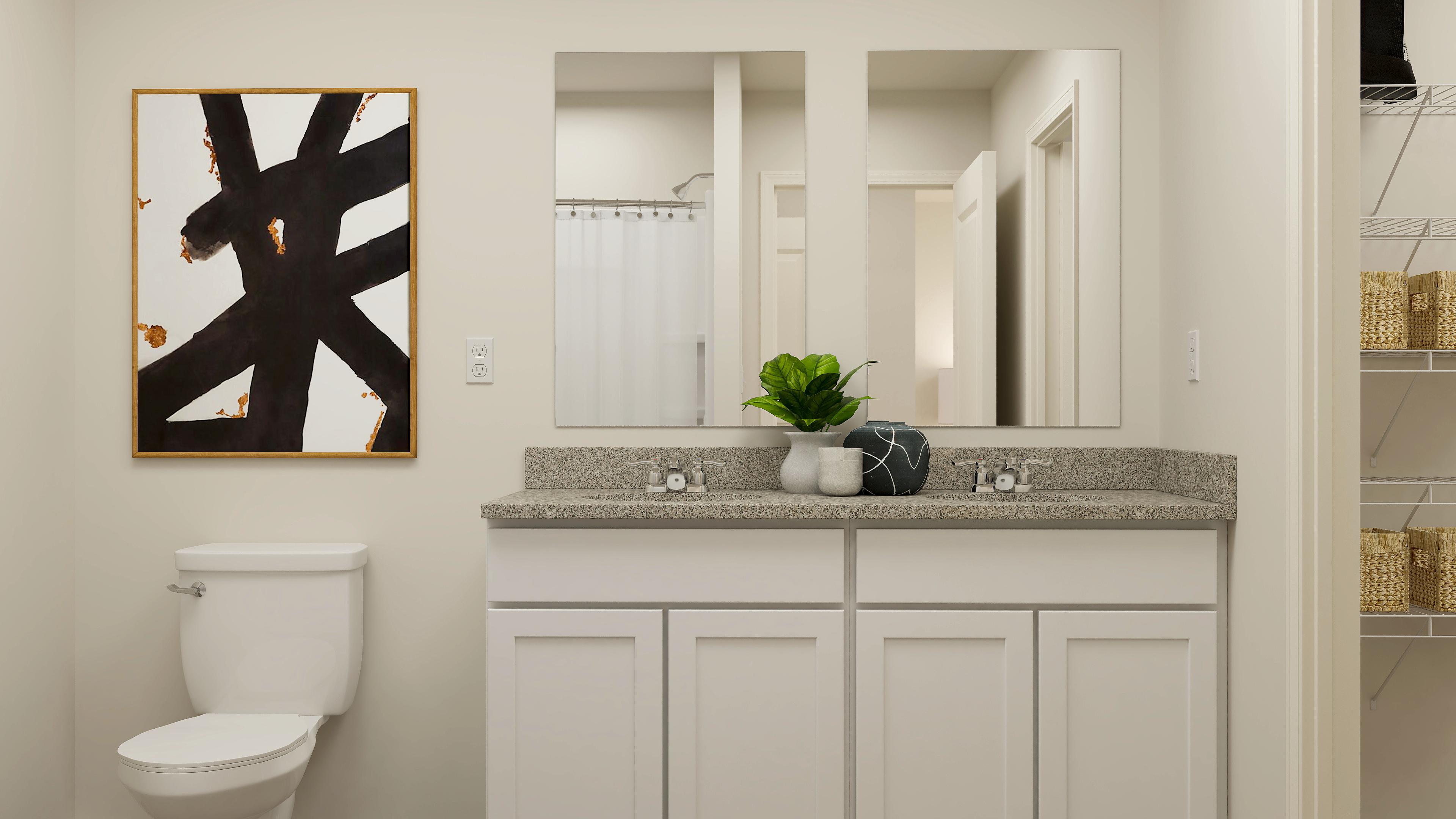 A bathroom with a large painting.