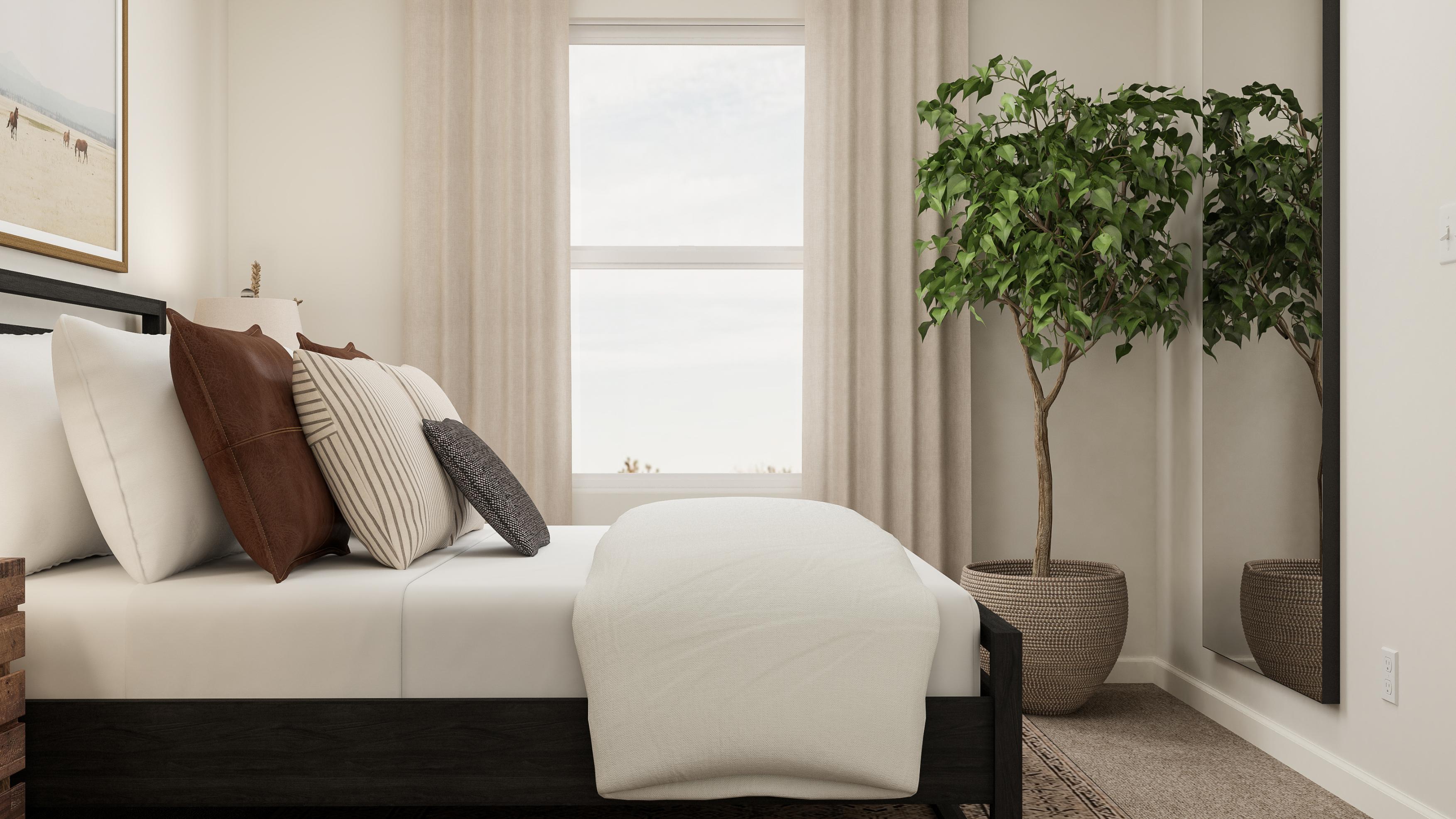 A white couch with pillows.