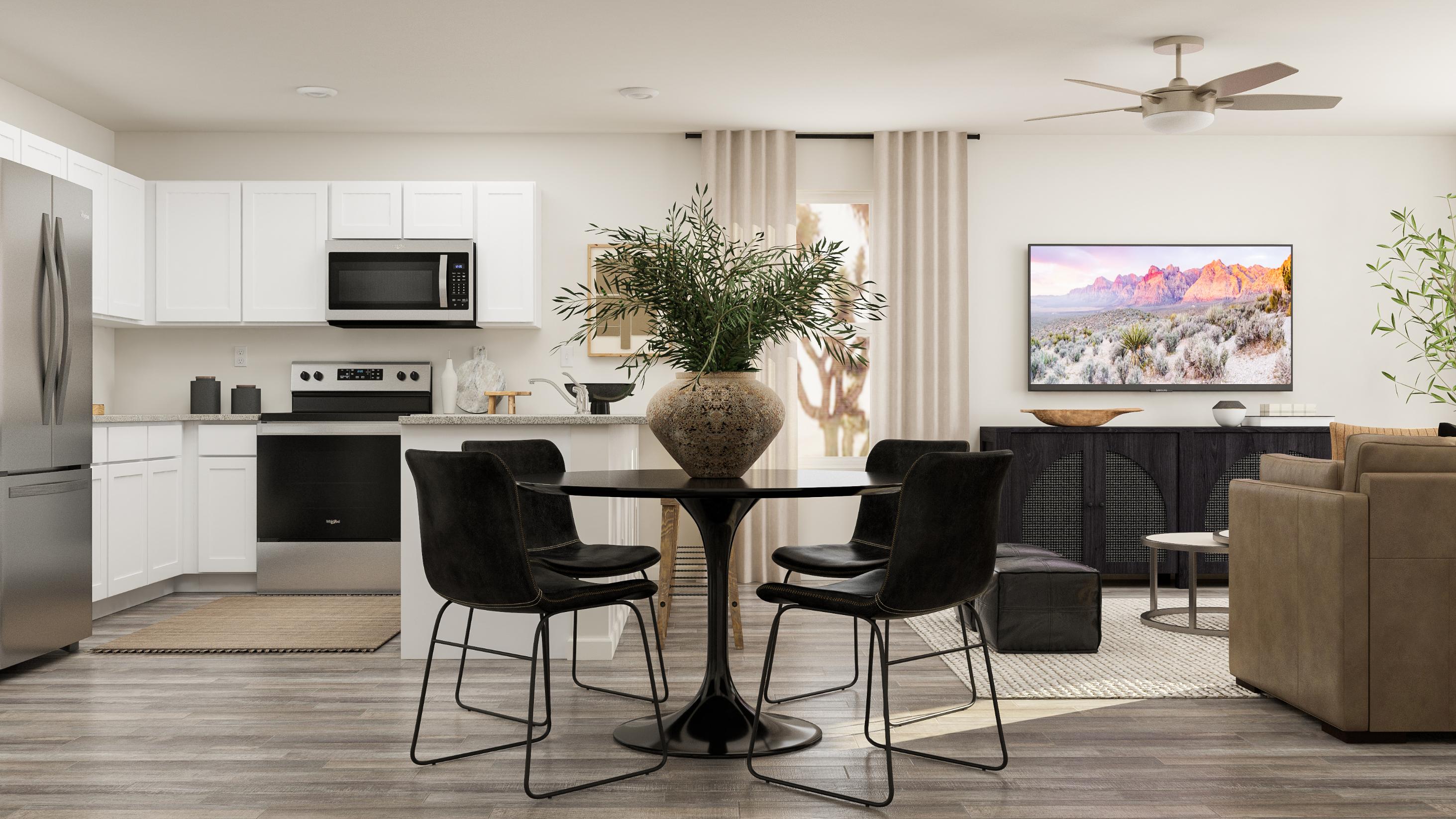 A living room with a table and chairs.