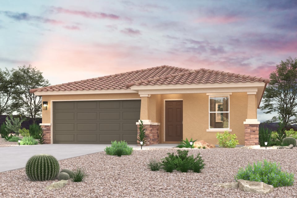 A house with a garage and bushes.