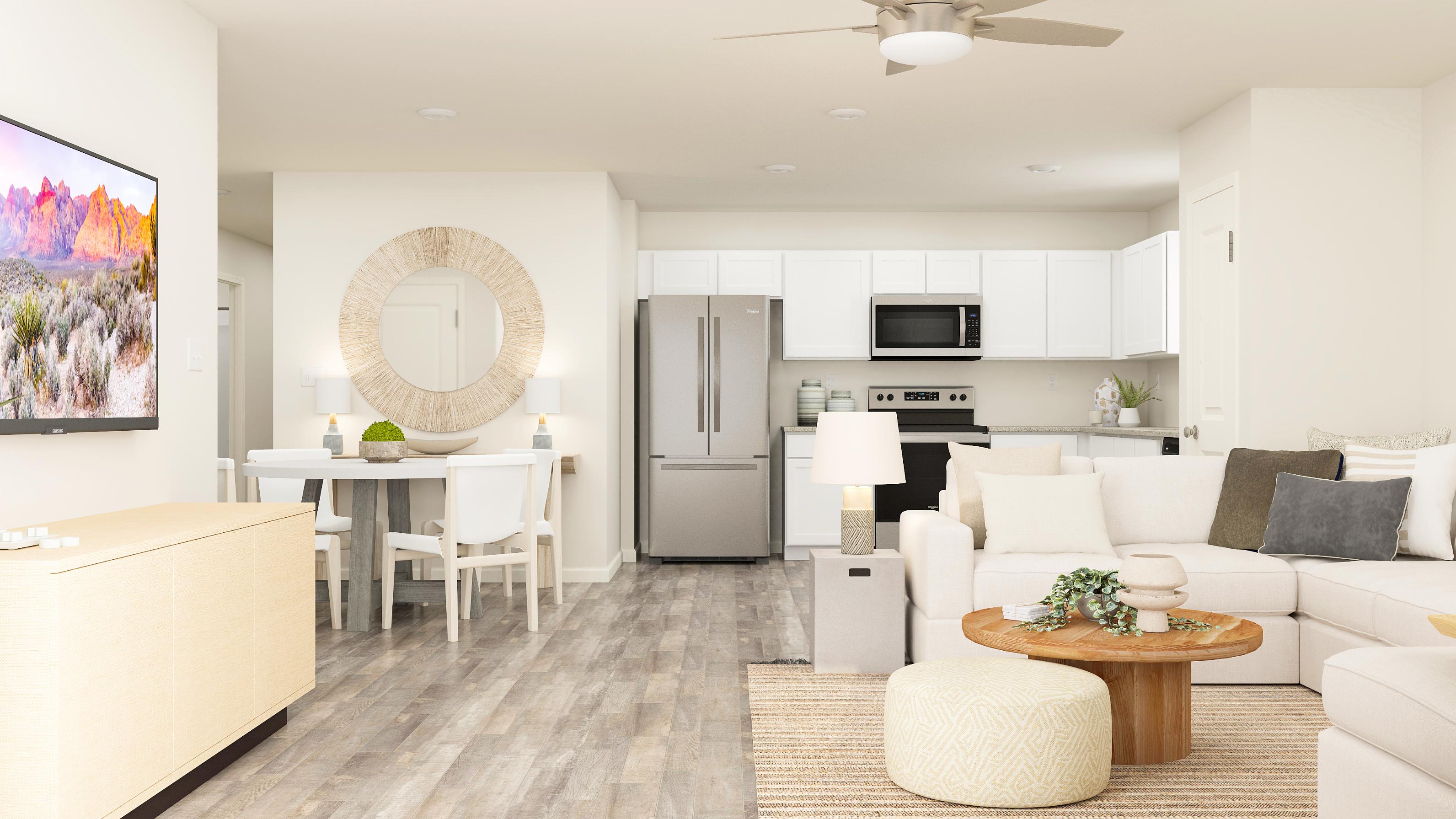 Great room opens to the kitchen and dining area.