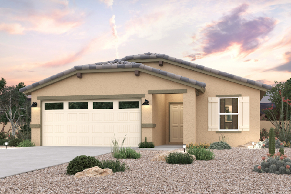 A house with a garage and a gravel driveway.
