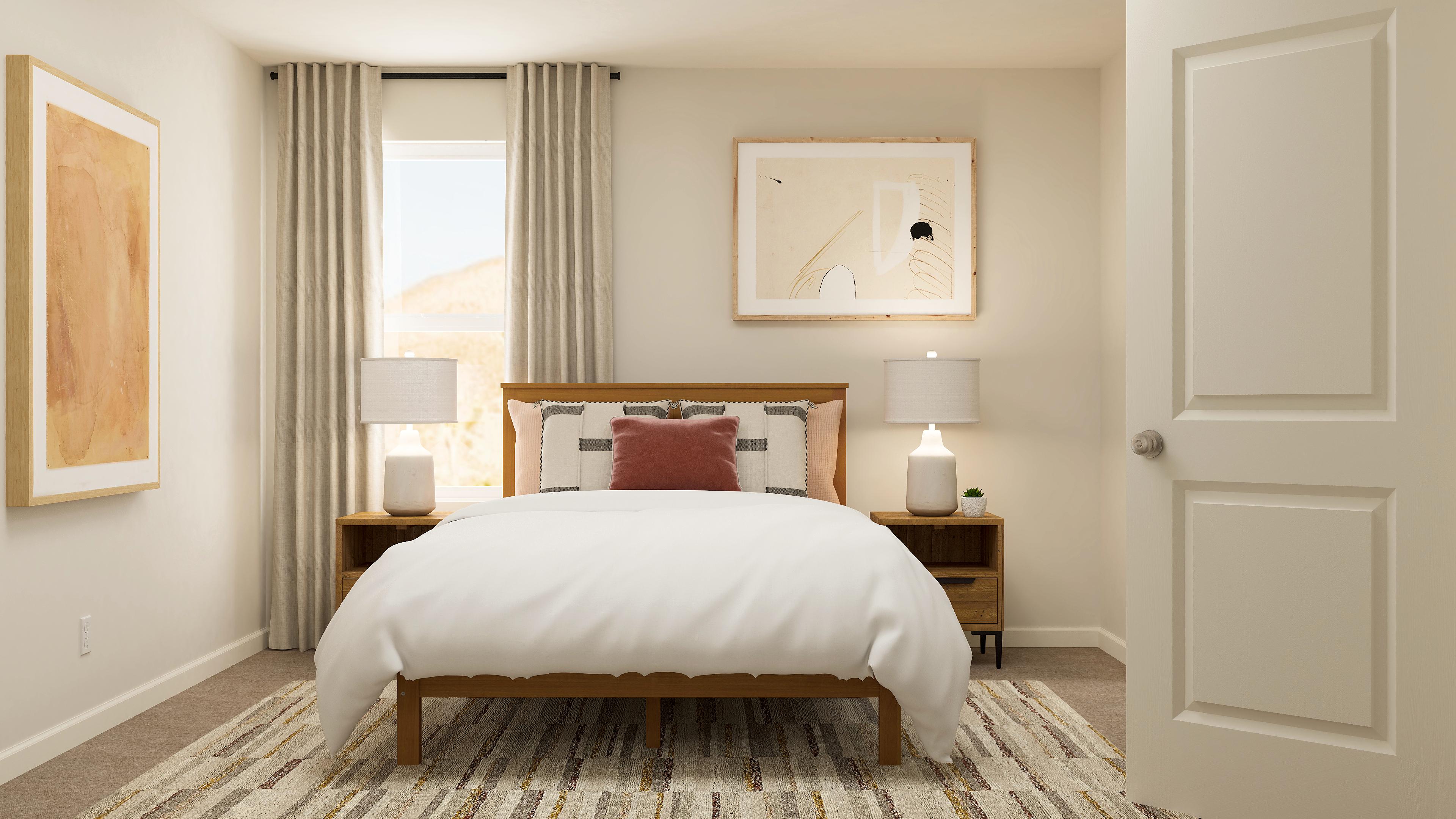 A bedroom with a bed and lamps.