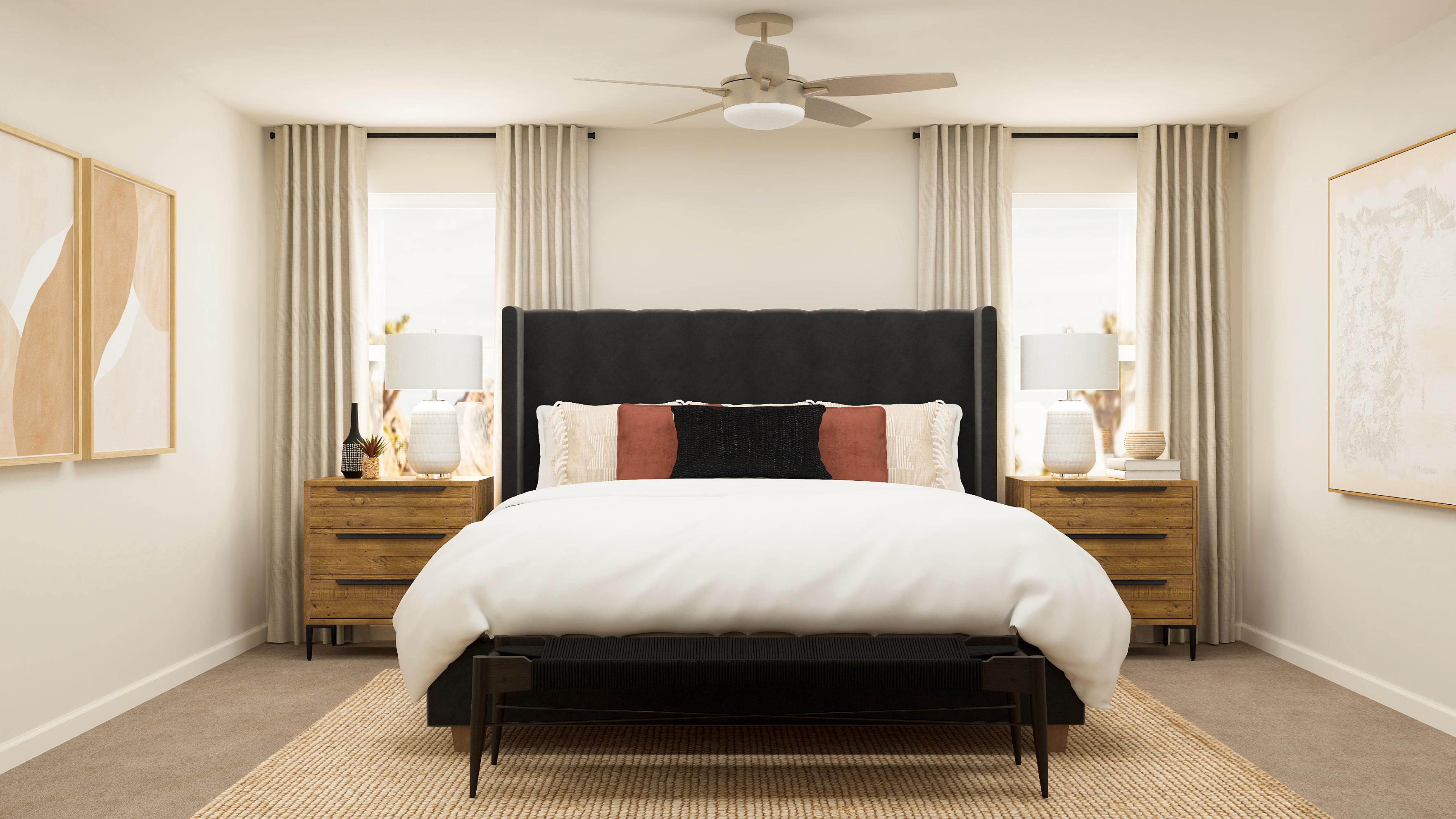 A bedroom with a bed and lamps.