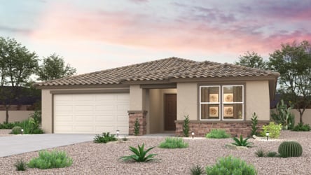 A house with a gravel driveway.