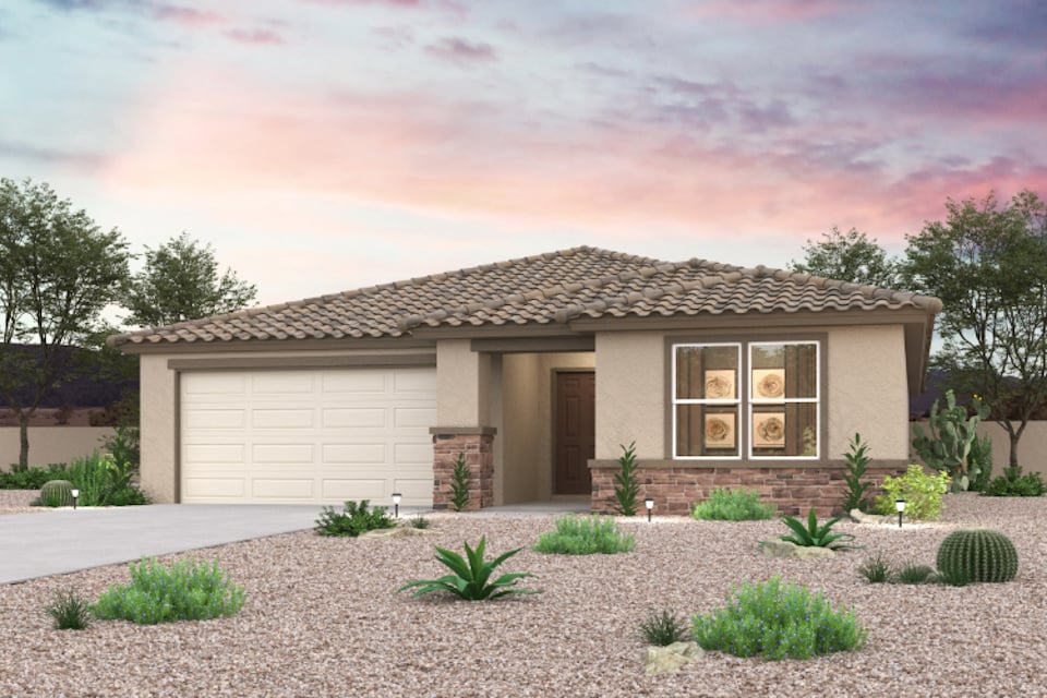 A house with a gravel driveway.